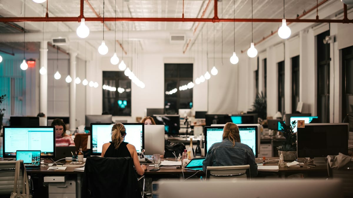 Team working together at computers in an office