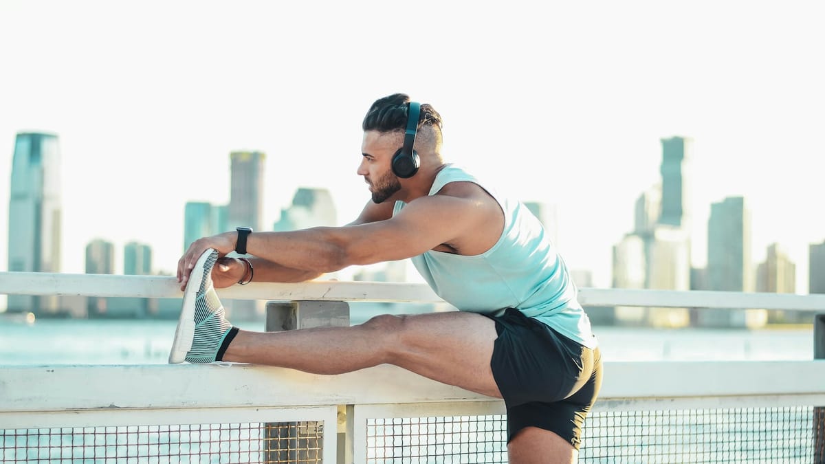 Athlete stretching outdoors before a workout