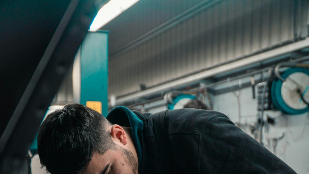 Mechanic working on a car engine