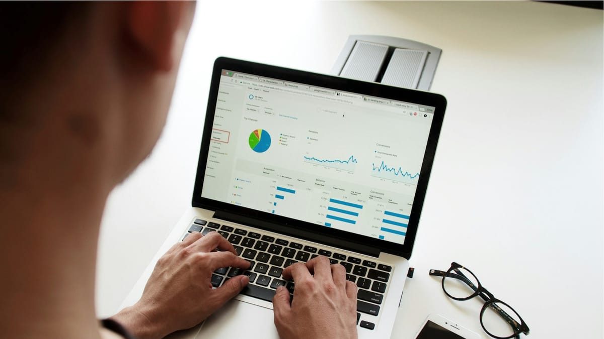 Person reviewing dashboards on a laptop